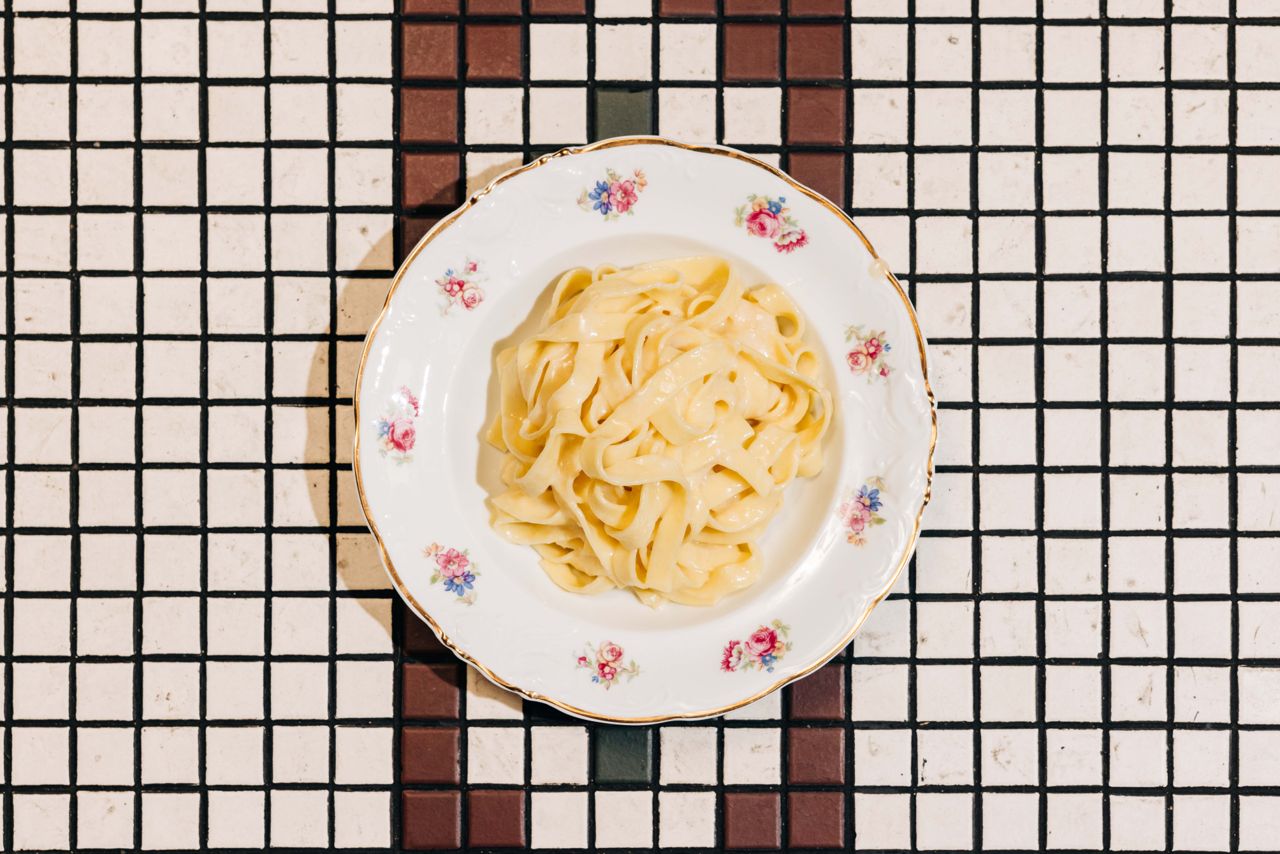 A plate of taglietelle alla parm wheel