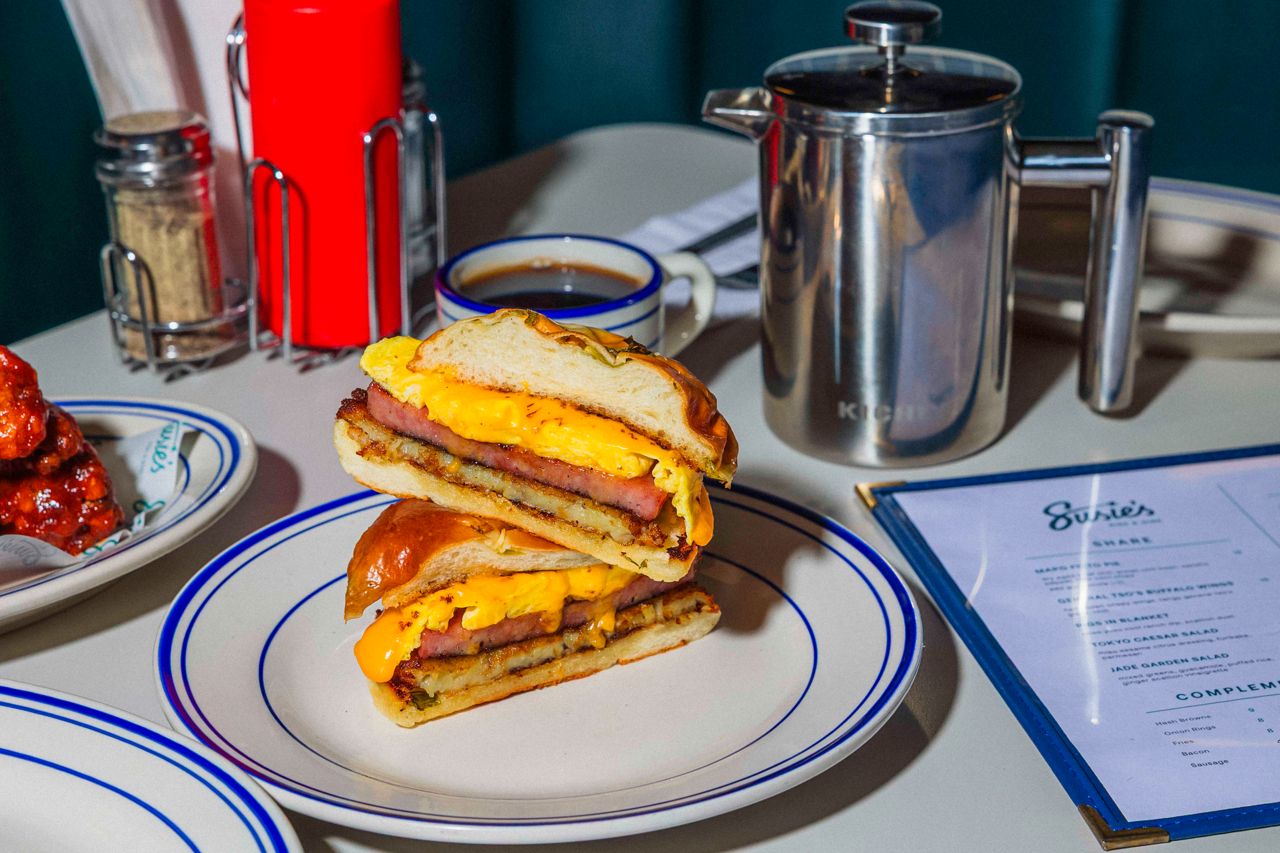 Two halves of a breakfast sandwich stacked on top of each other