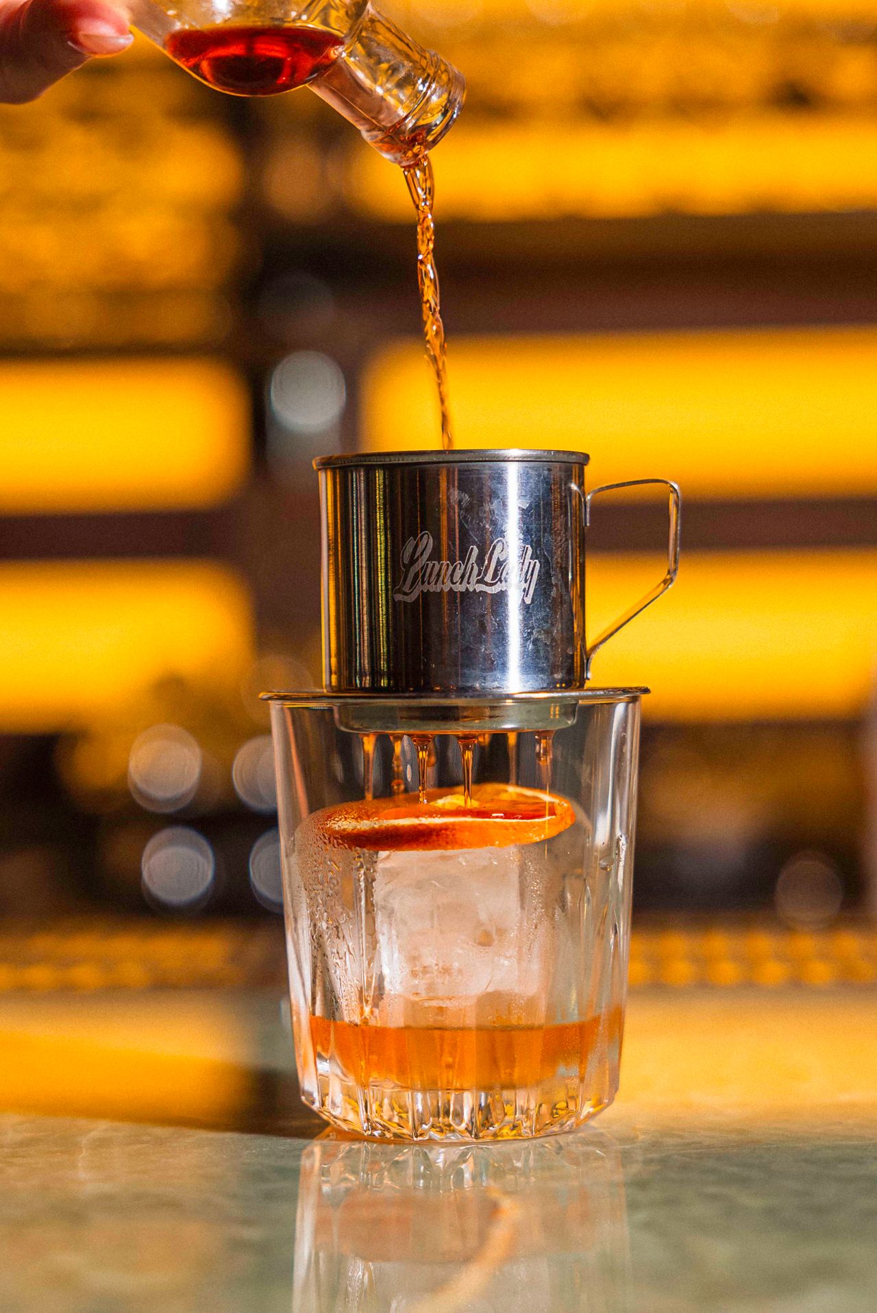 The Ca Phe Negroni is a traditional take on the drink passed through a phin, a Vietnamese coffee filter, filled with Robusta coffee