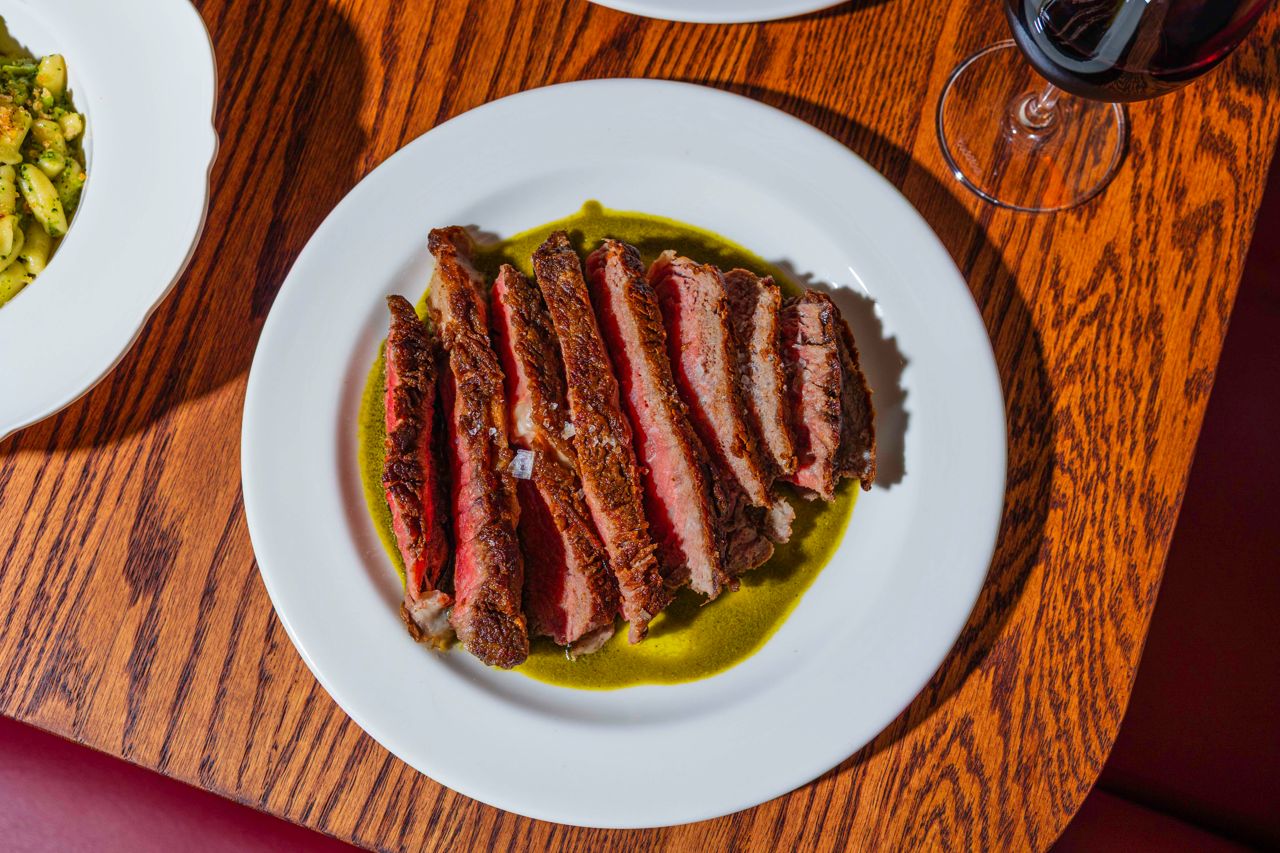 A seared ribeye with a bright oregano salsa verde