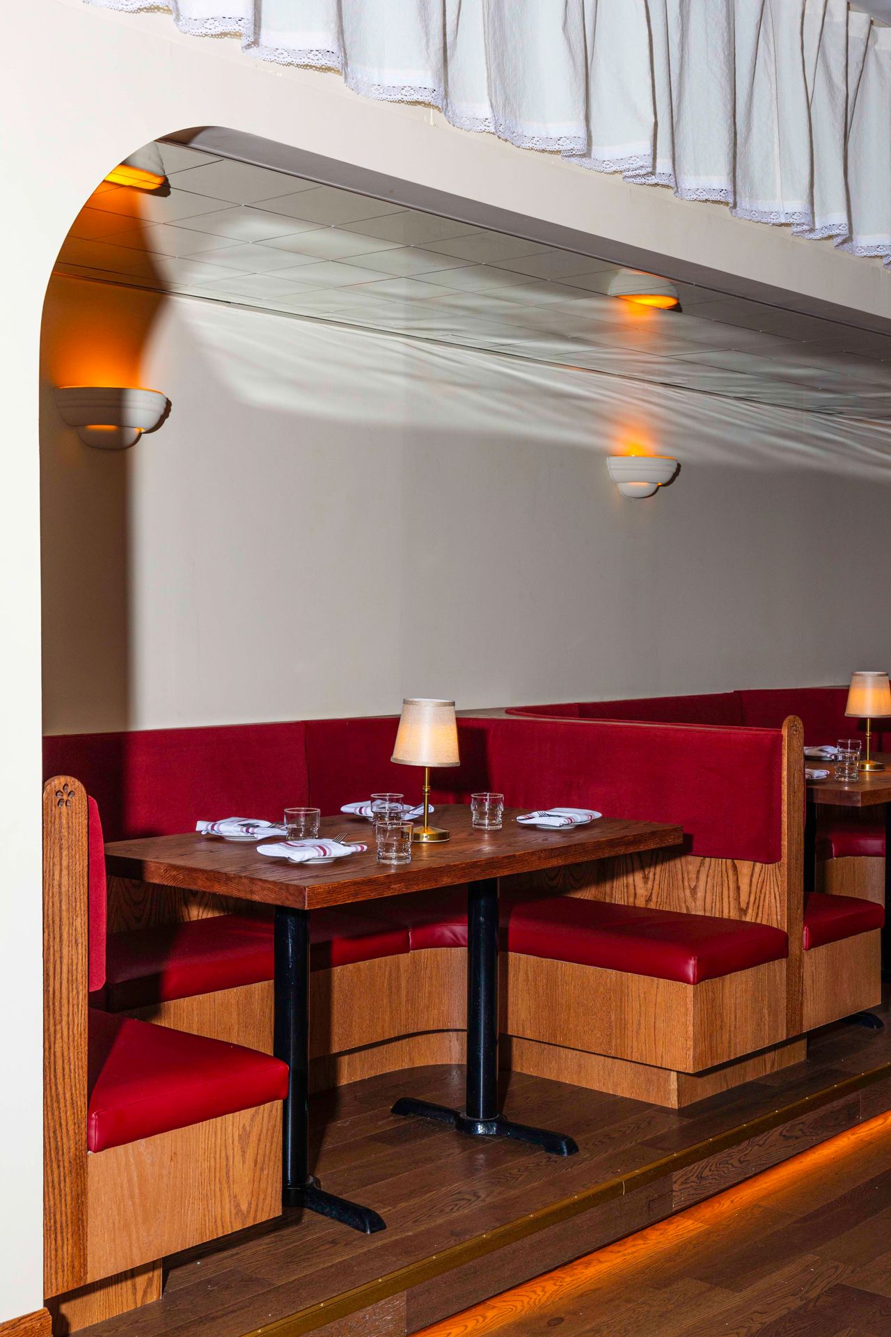 Booth seating in the dining room of Zia's Place, an Italian restaurant