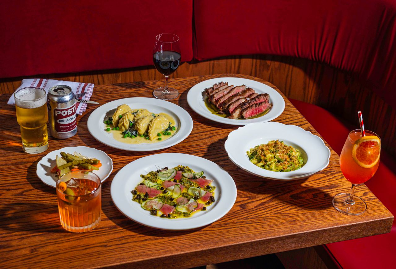 A spread of Italian dishes and drinks at Zia's Place in Toronto