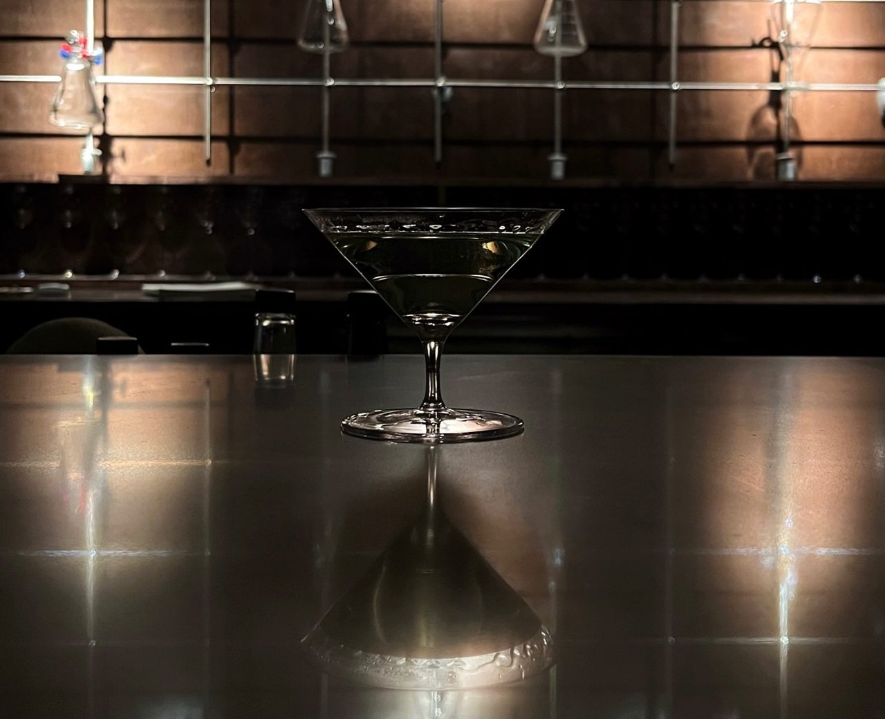 A martini on the bar at Uh Bar, a cocktail lounge in Toronto