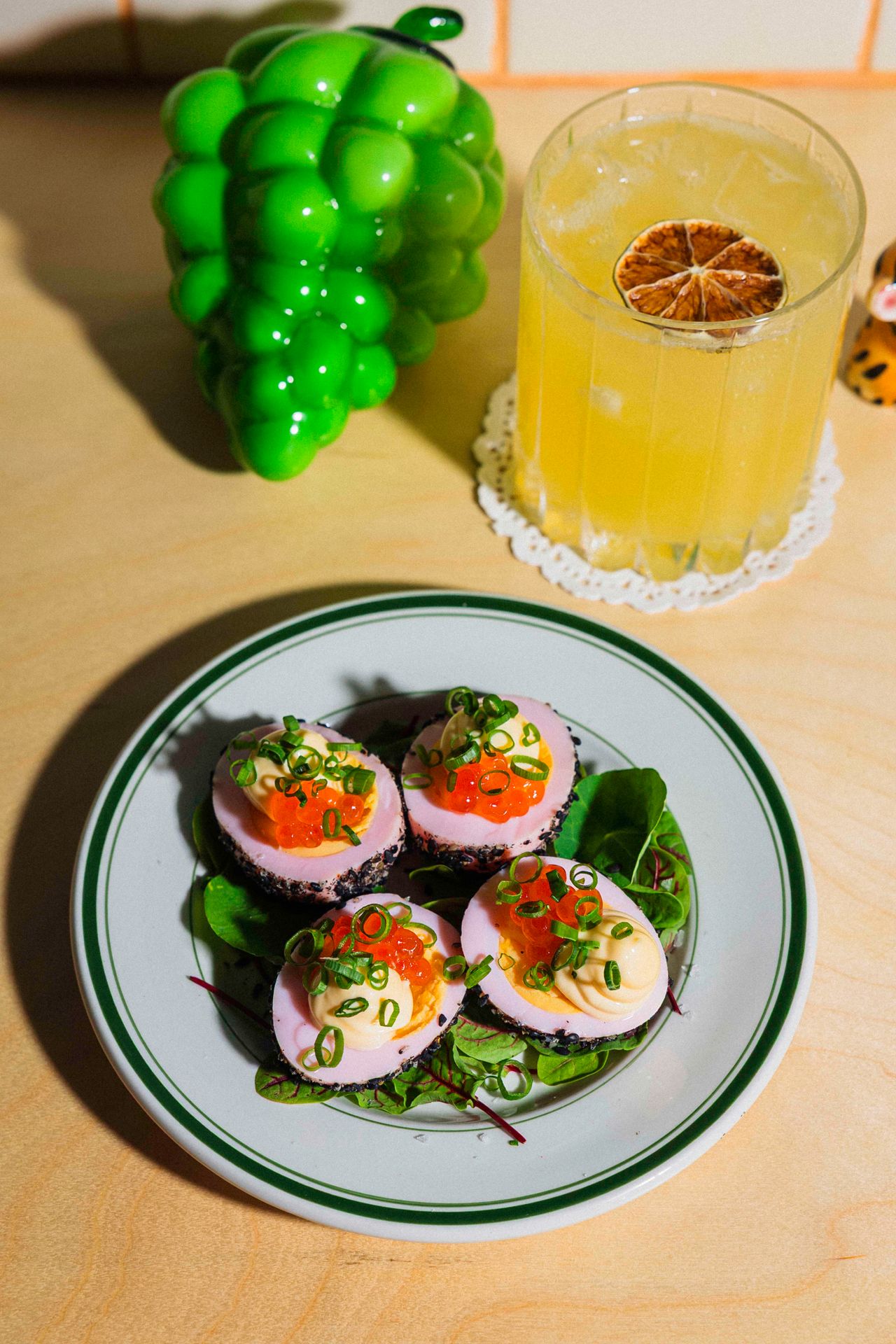 The pickled eggs are devilled, then topped with chives and salmon roe