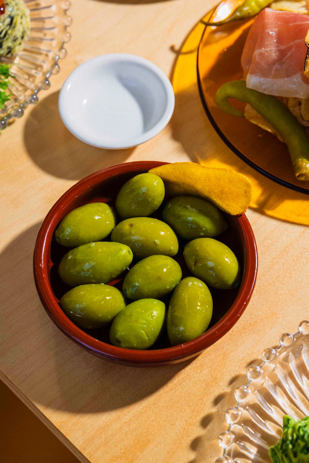 Cerignola olives are marinated with citrus peels, dried chili peppers, lemon oil and spices