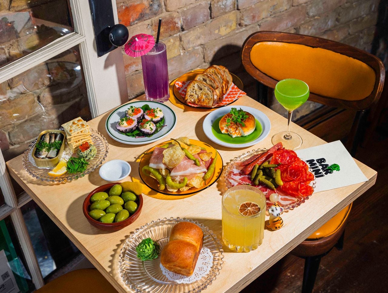 A spread of drinks and snacks at Bar Mini in Leslieville