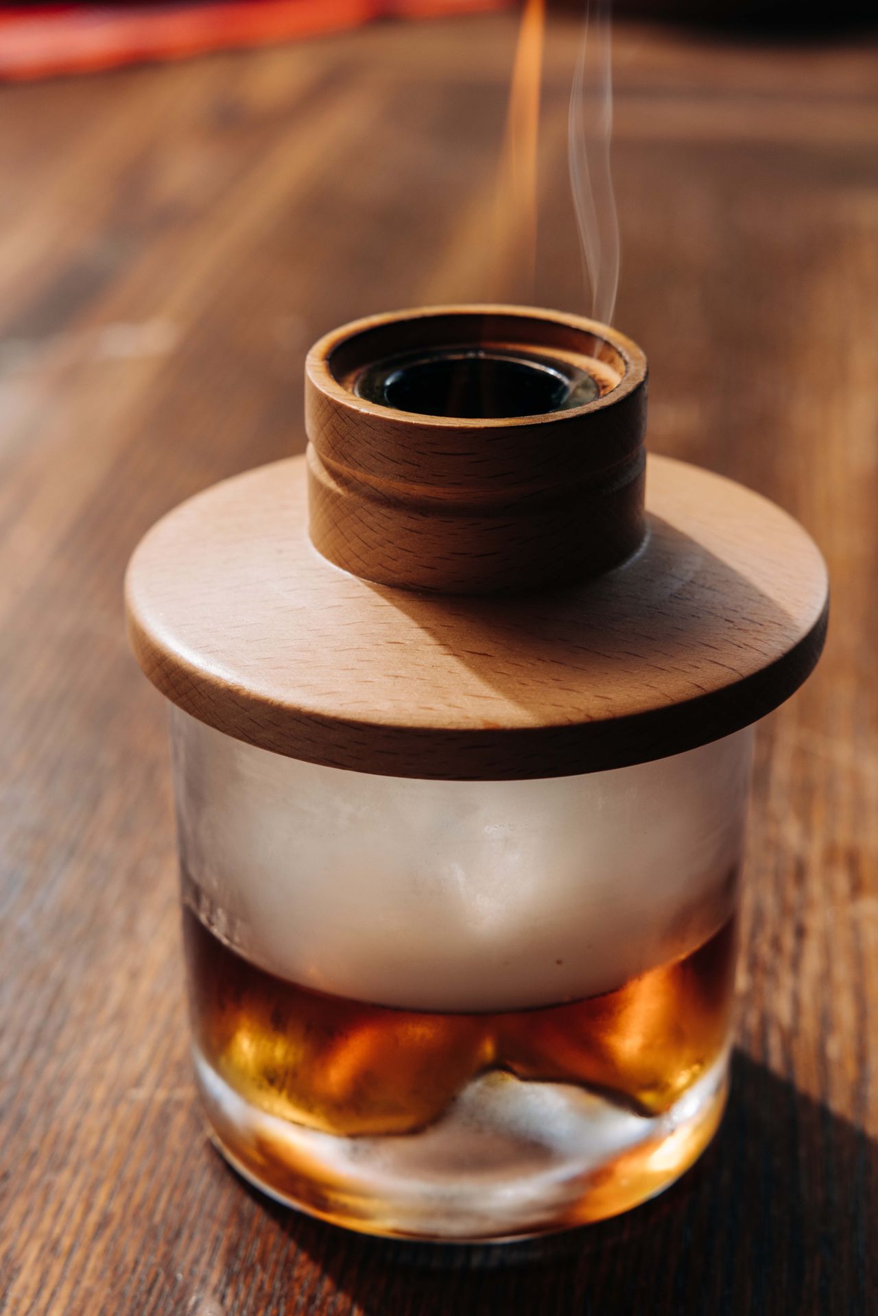 The Kanlaon Drift is a brooding riff on an old fashioned made with Don Papa rum and muscovado syrup in place of whisky, then capped and infused with smoke for a dramatic, aromatic finish