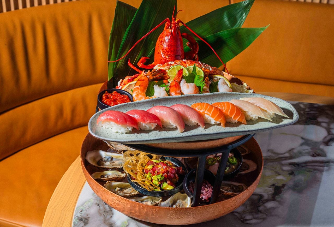 A tiered seafood and sushi platter