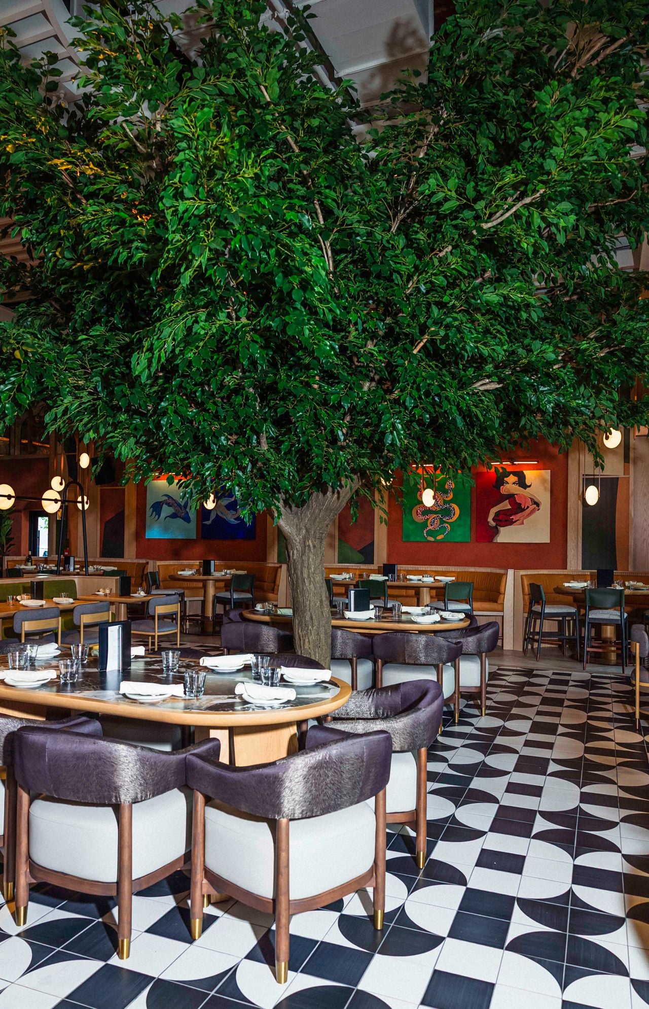 A tree grows in the middle of the dining room at Queens Harbour