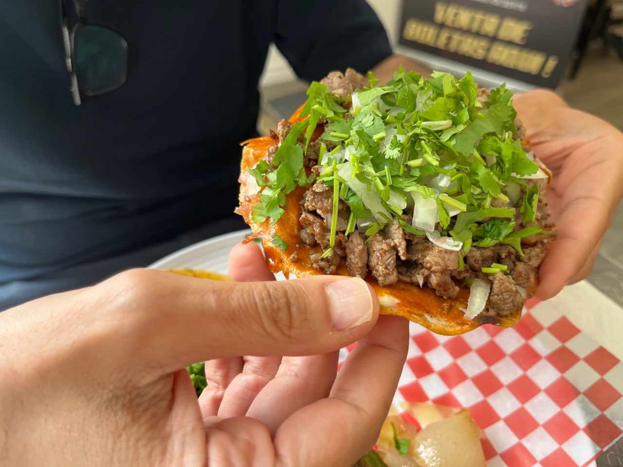A person holds up a sirloin volcane