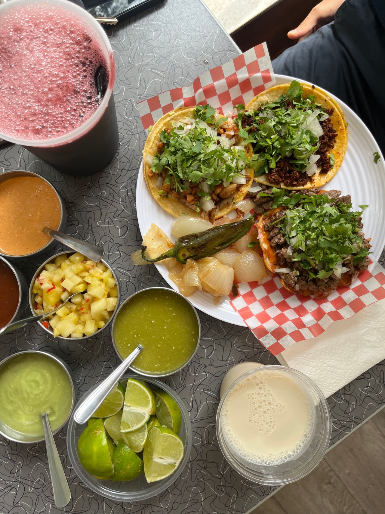 A plate of tacos and all the fixings
