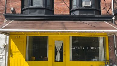 This bright-yellow building near Bickford Park is a beacon for west-end wine lovers