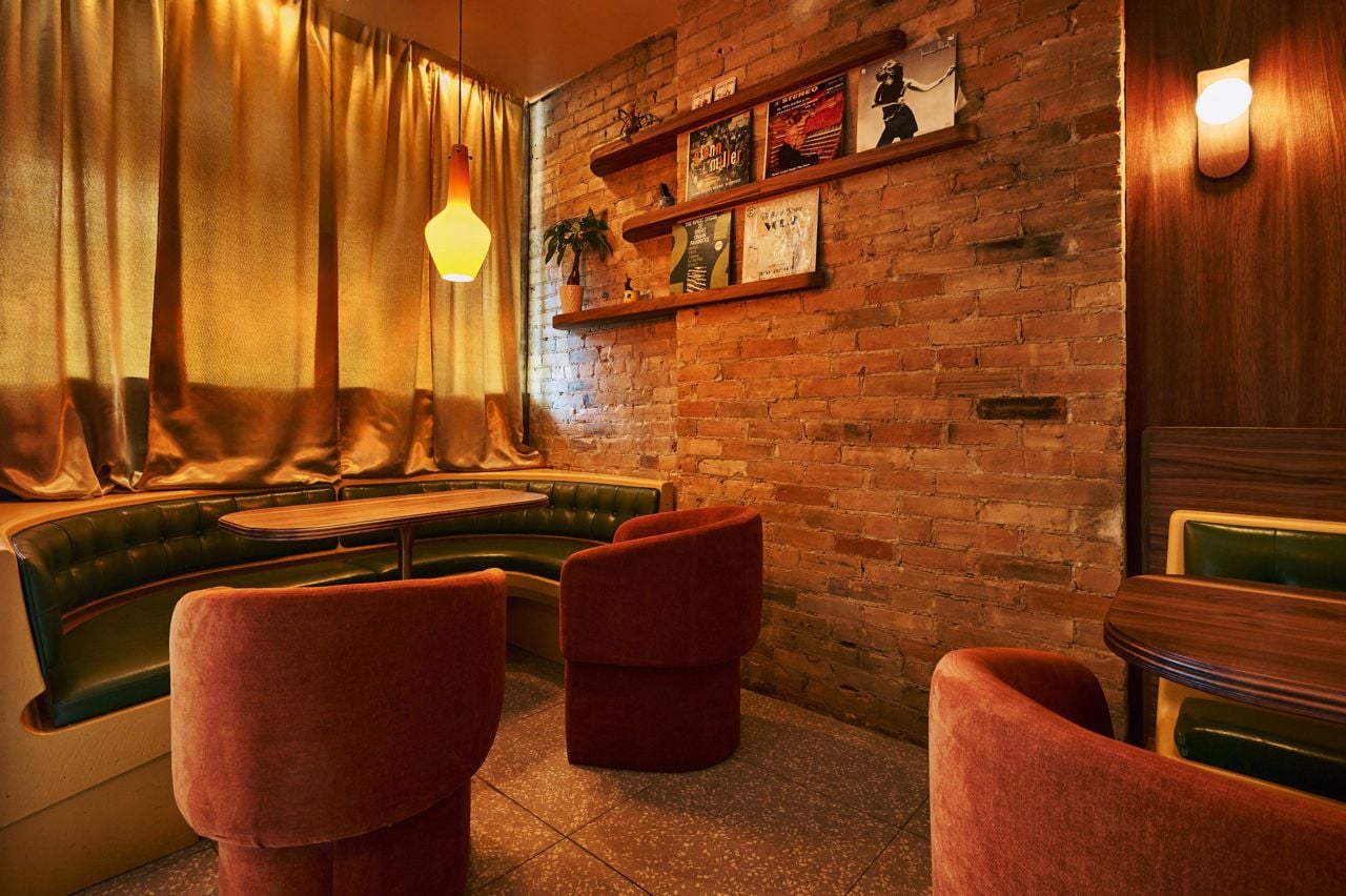 A horseshoe-shaped booth at the front of Lonely Diner