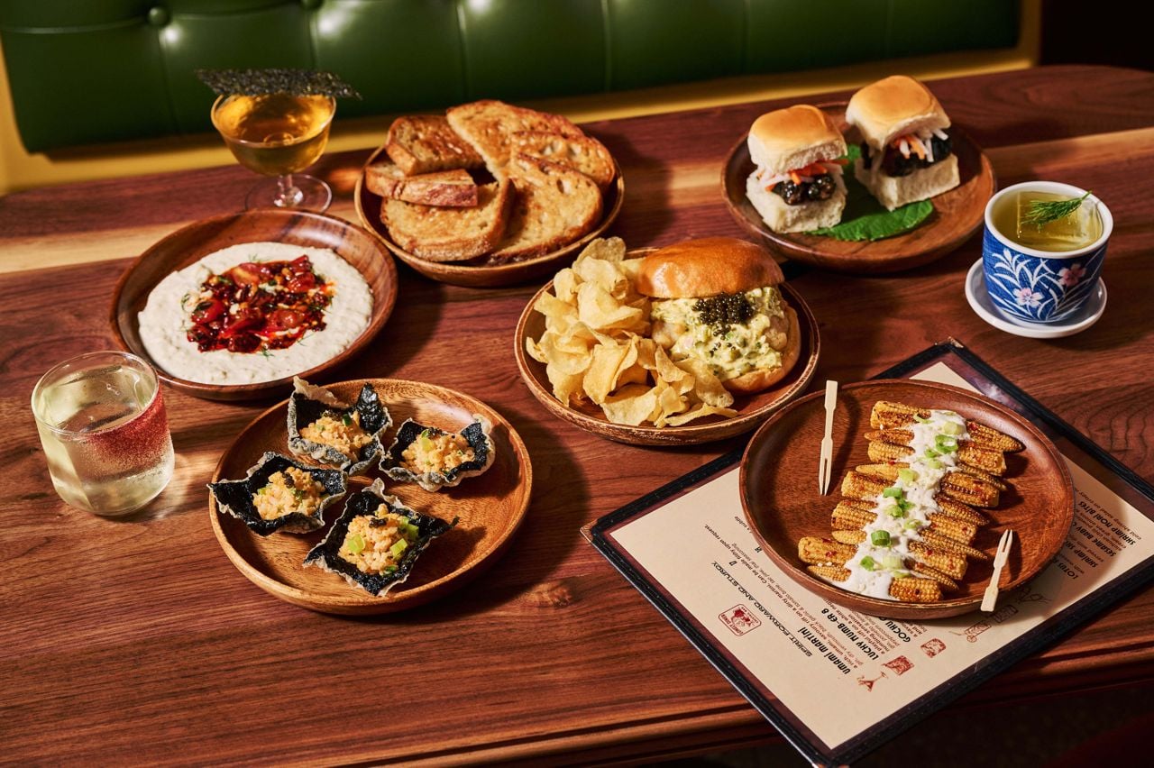 A spread of dishes and drinks at Lonely Diner