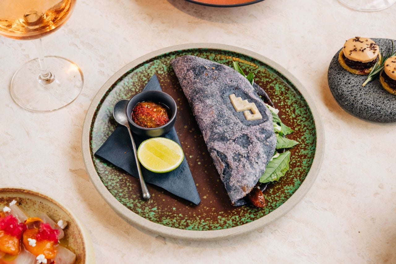 This game-changer of a quesadilla starts with a hand-pressed tortilla made from blue heirloom corn, which is folded around funky queso and herb-driven lamb