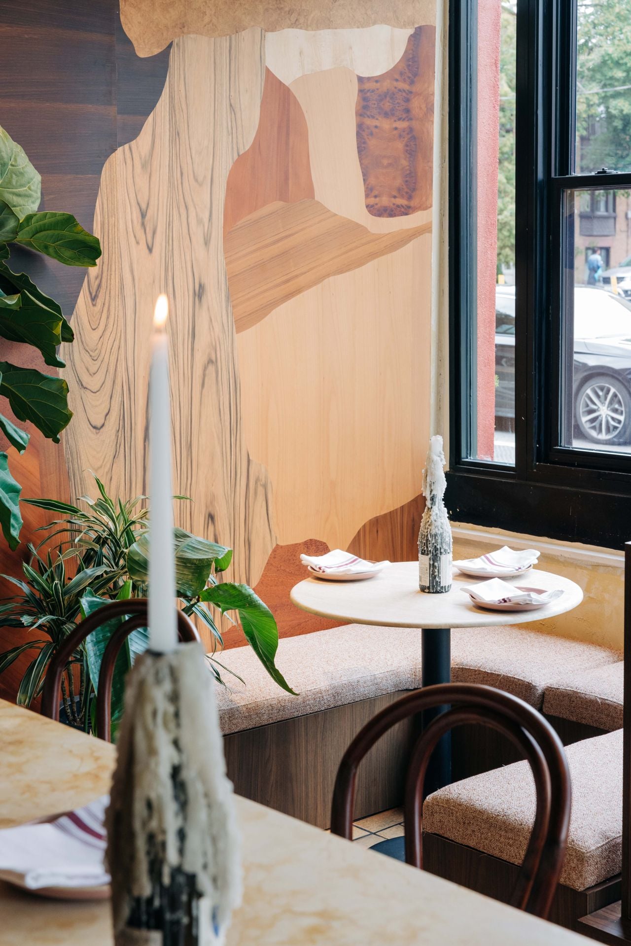 A corner table by the window in the dining room of Antylia