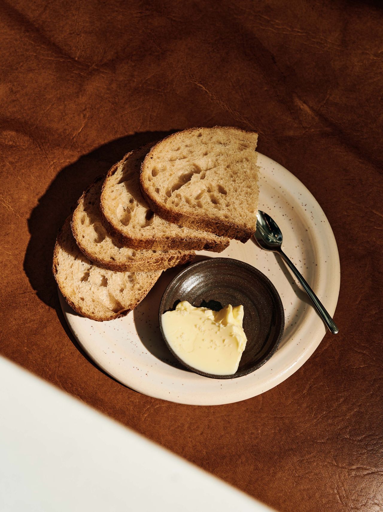 Thick slices of exquisite sourdough bread with cultured butter