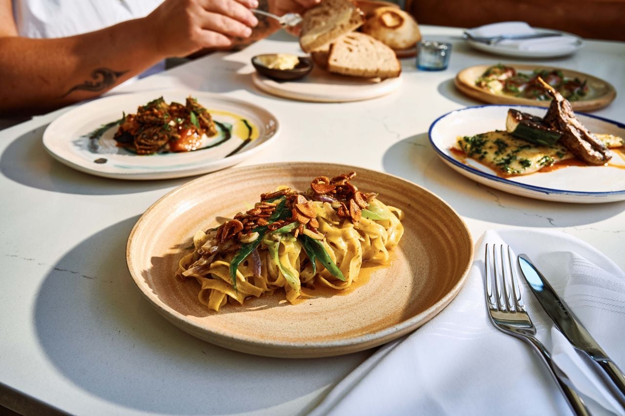 House-made semolina tagliatelle is dressed in a hot sear of garlic, shallots and sansho peppercorns, then tossed with lemon juice, olive oil, and butter
