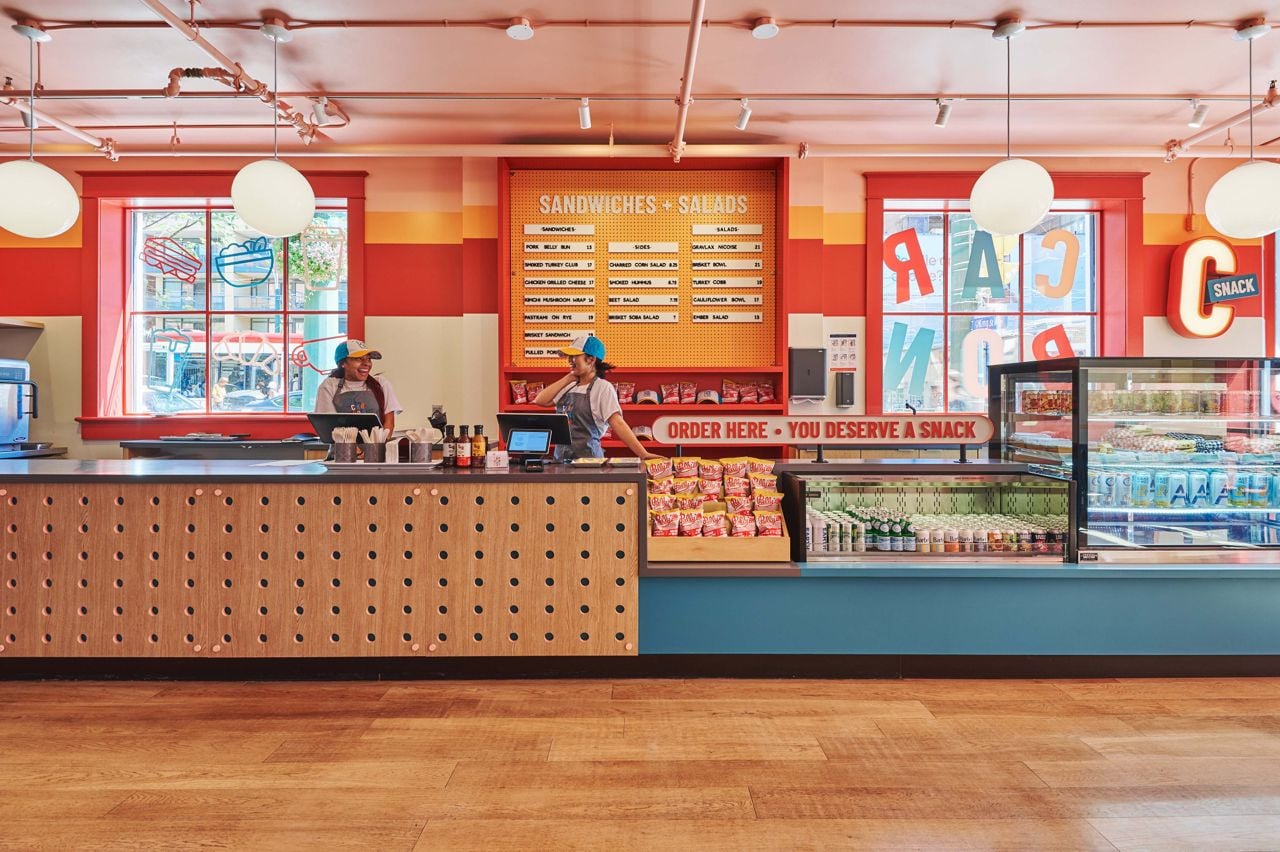 Team members behind the counter at the Carbon Snack Bar in Toronto