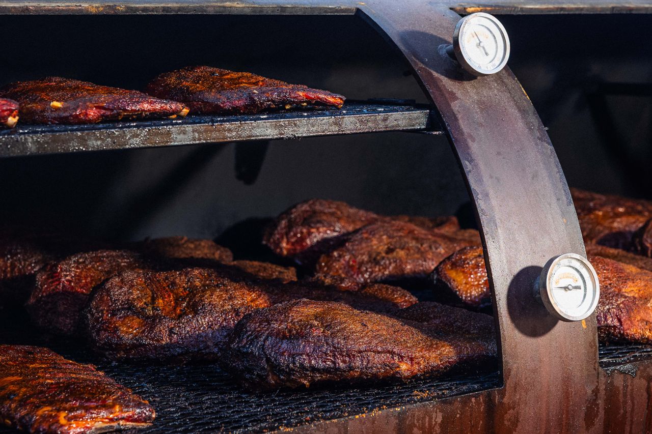 Whole briskets inside a smoker
