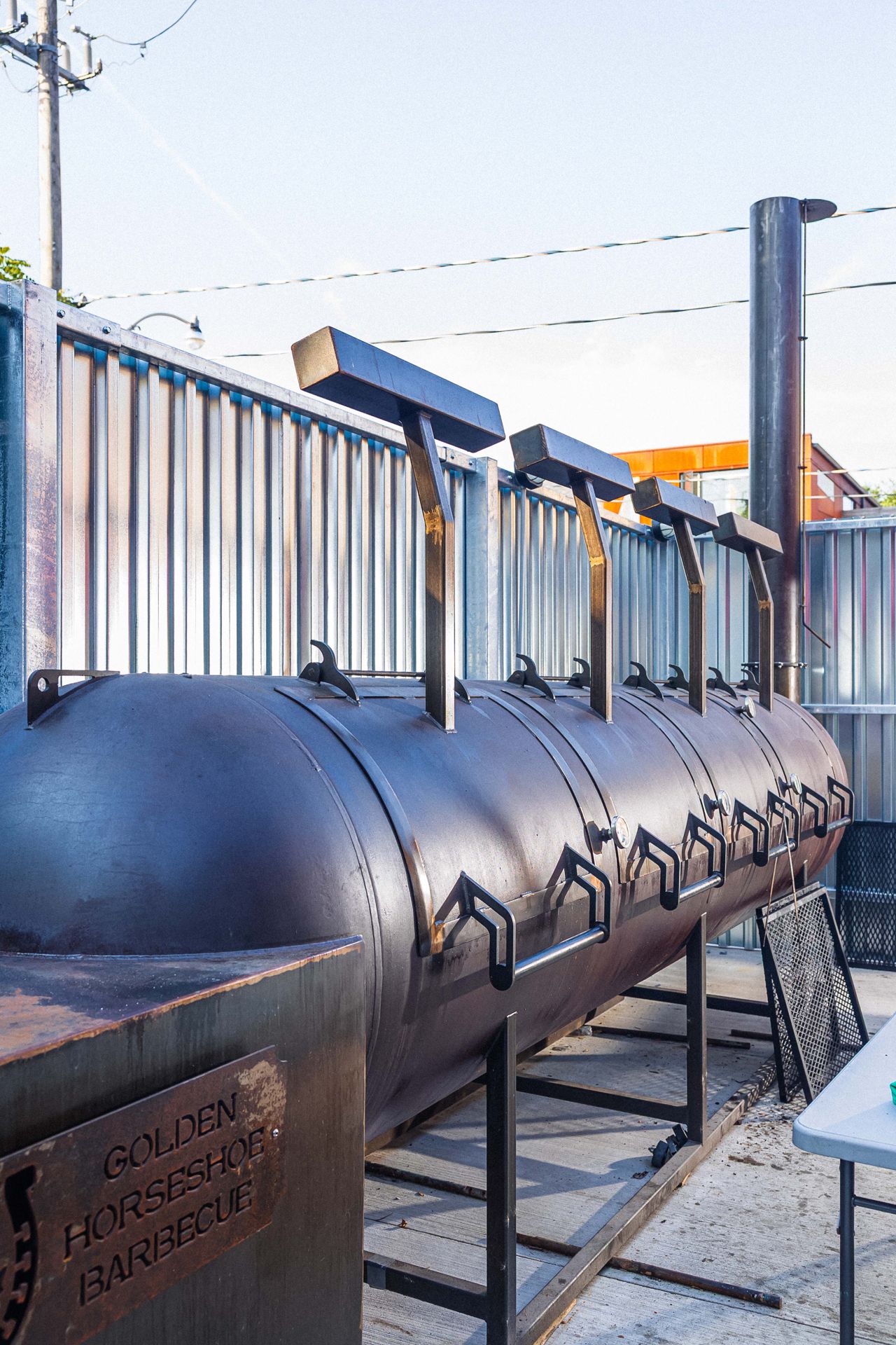 One of the two massive smokers on the patio at Golden Horseshoe Barbecue