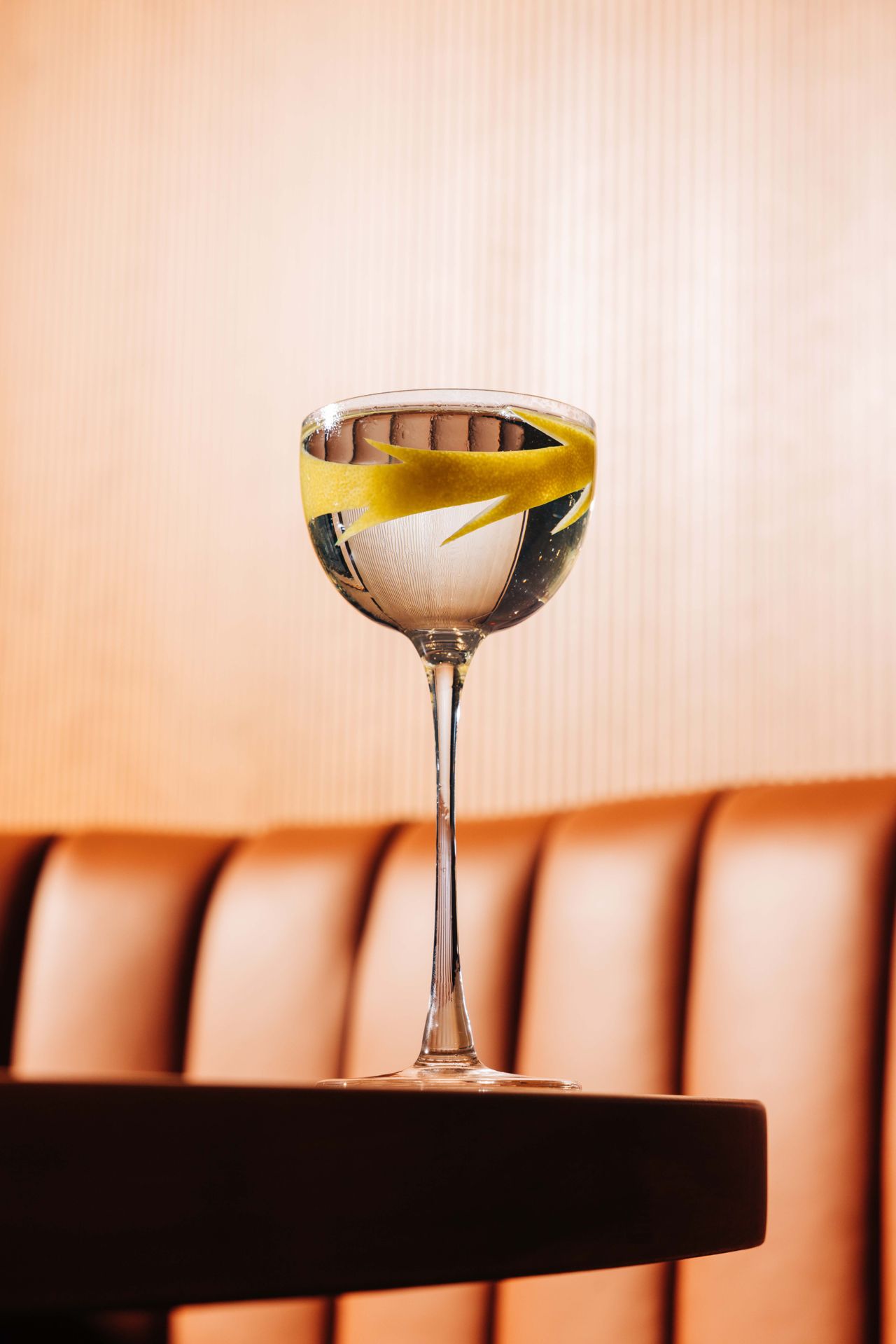 The Botanist martini is a balanced composition of gin, house vermouth, and house citrus, lavender and Japanese peach bitters