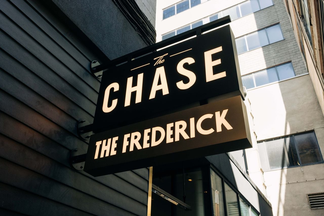 The sign outside of the Chase and the Frederick, sister restaurants in Toronto