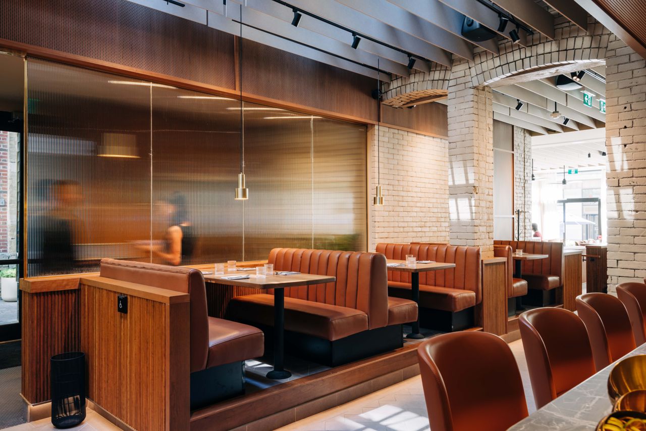Booth seating in the dining room of the Frederick in Toronto