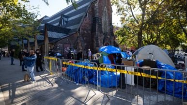 A churchyard homeless encampment was cleared less than 24 hours after a priest received the Toronto Book Award for writing about it