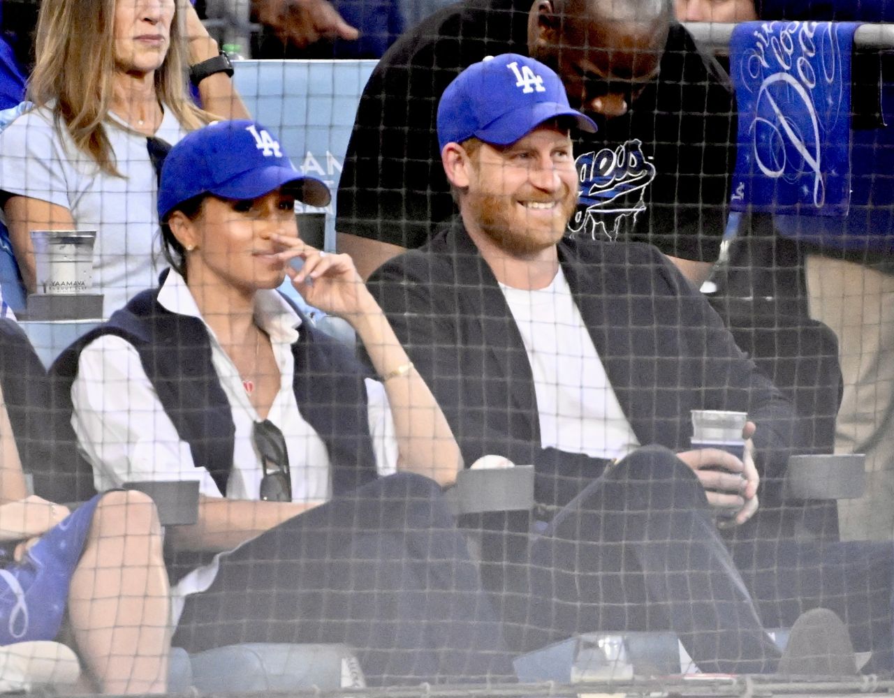 Prince Harry and Meghan Markle commit baseball treason in Dodgers caps