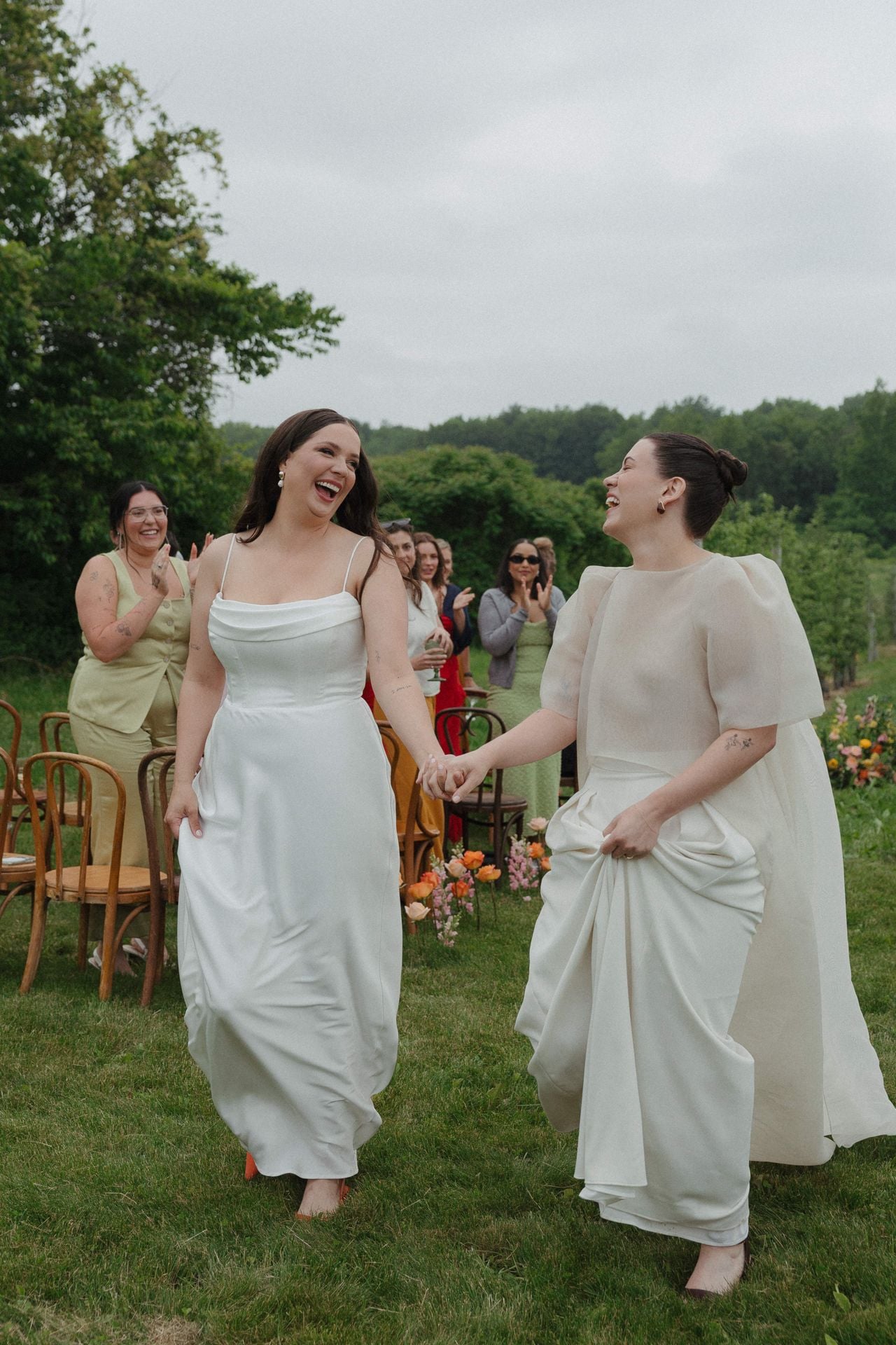 Two brides running.
