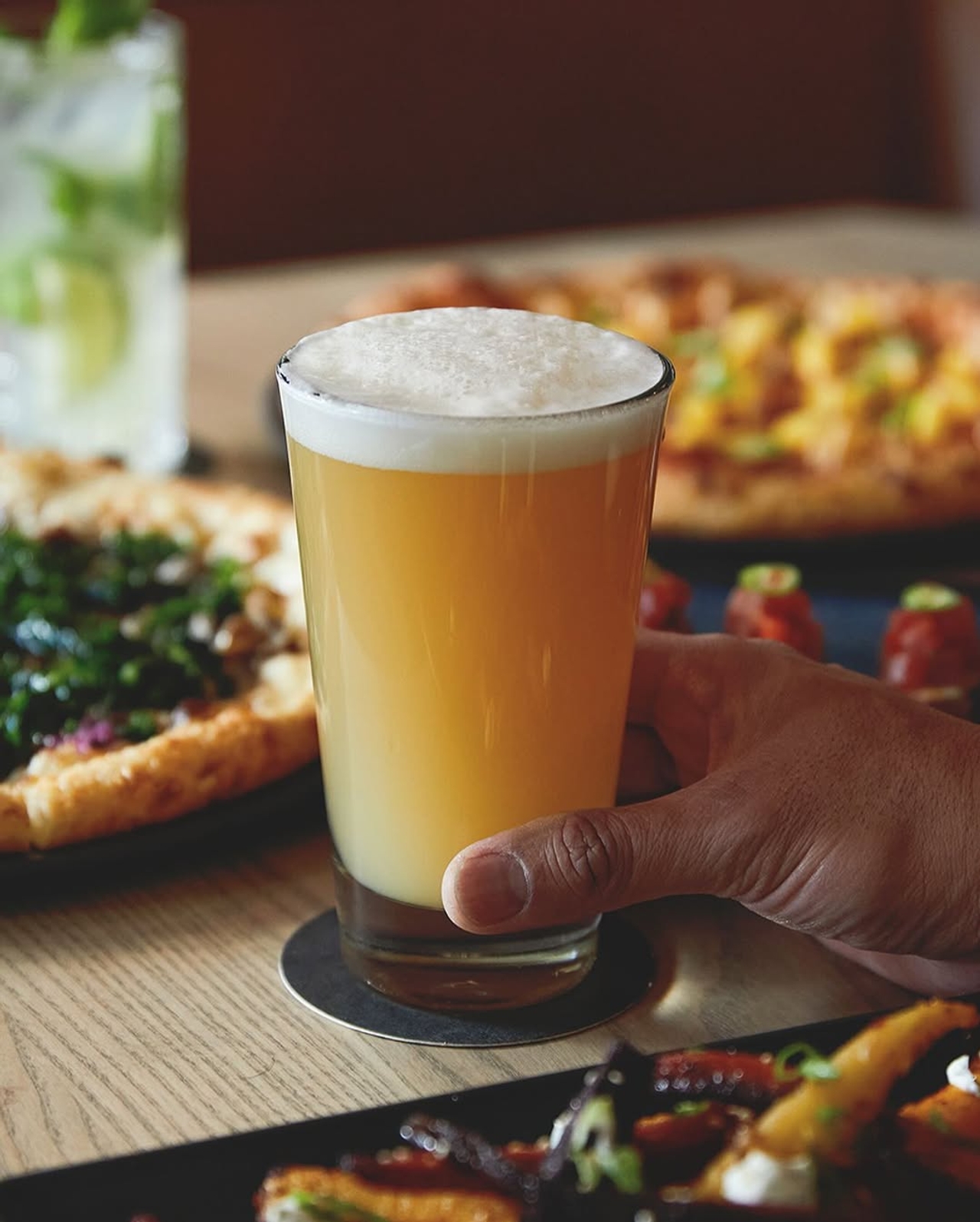 A pint of beer and some pizzas at King Taps