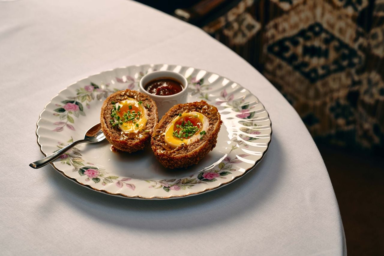 A scotch egg with curried ketchup