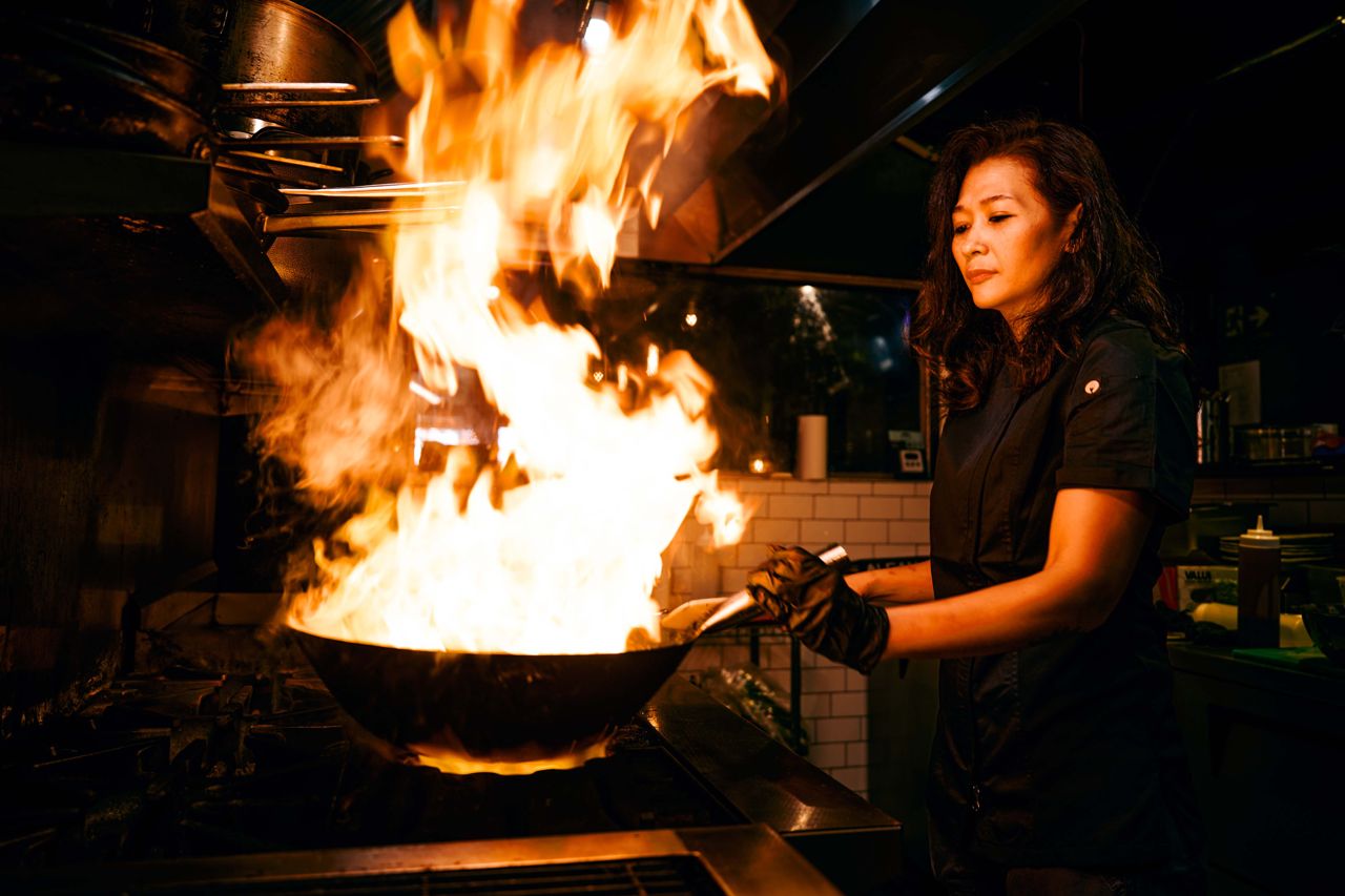 Executive chef Andrea Santawirya plays with fire