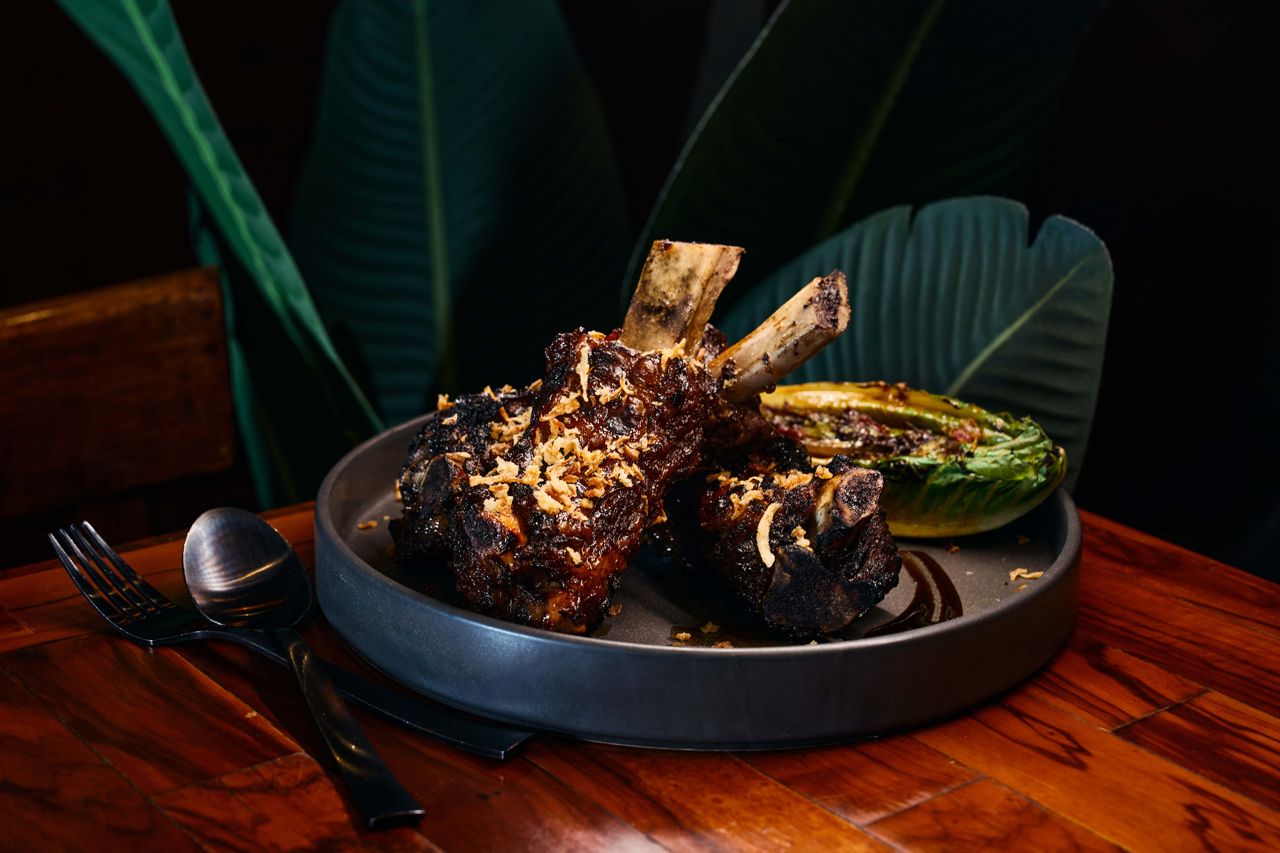 Braised and grill beef ribs served with grilled romaine hearts