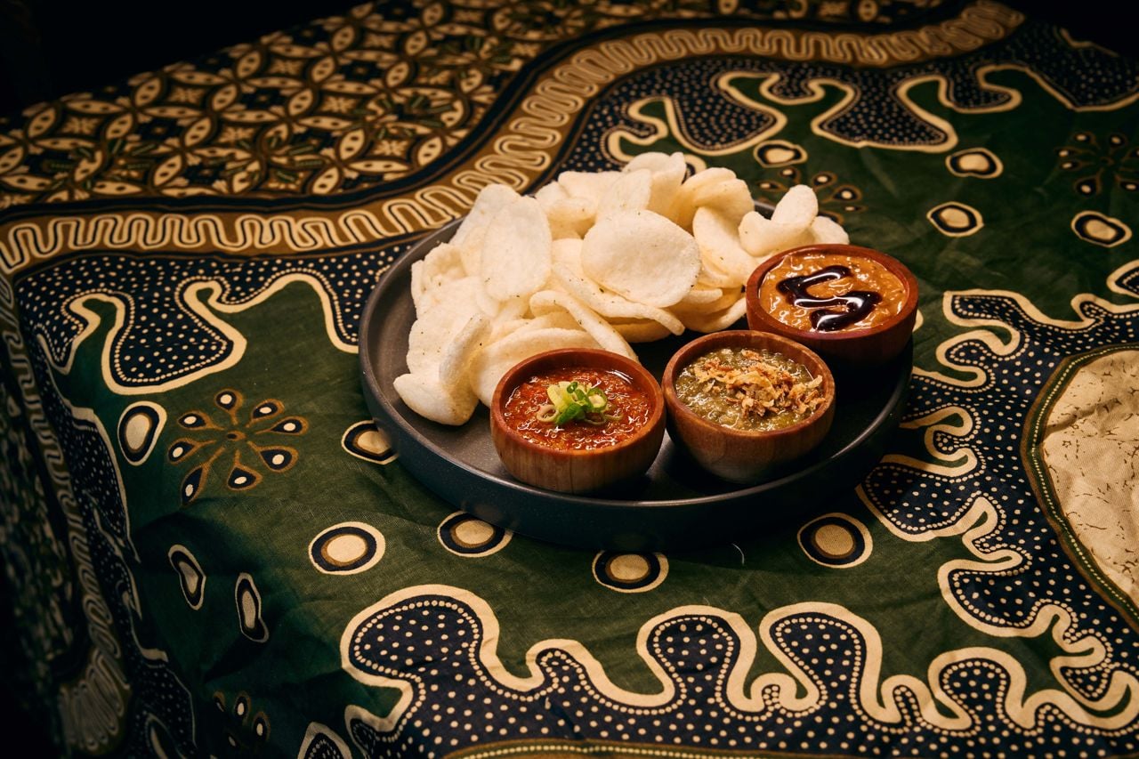 A flight of three Indonesian sambals with shrimp chips