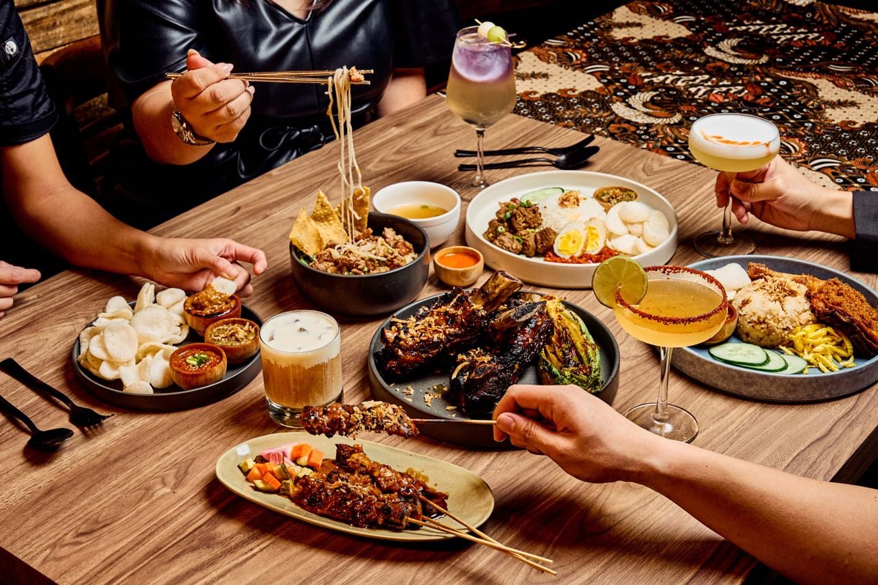 A spread of dishes and drinks at Sambal, an Indonesian restaurant