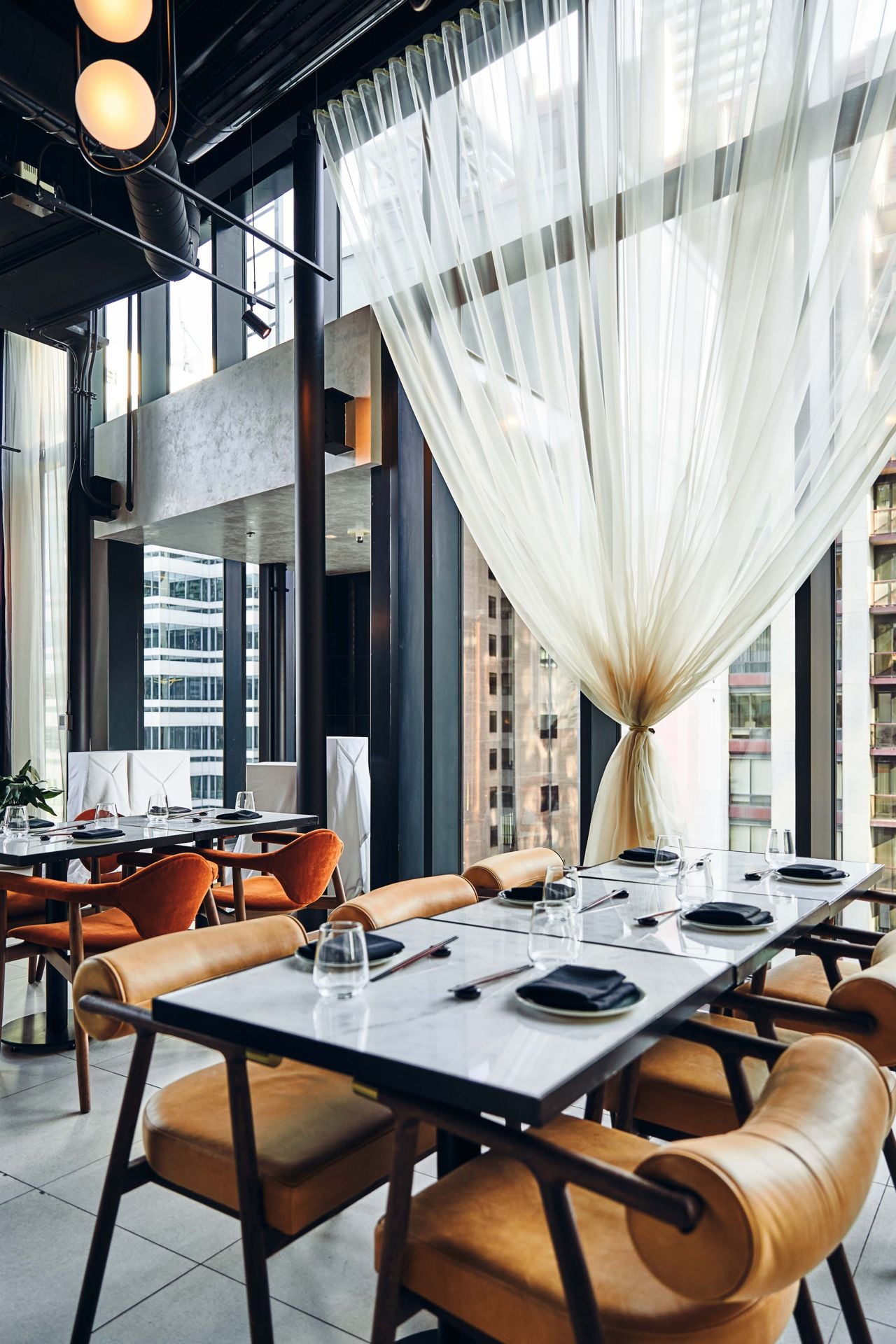 Tables in the dining room of Tono by Akira Back