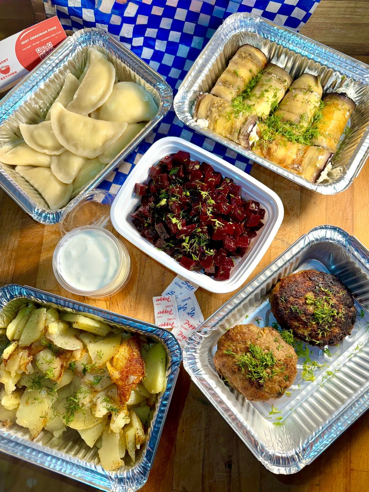 A spread of takeout dishes from Borscht Kitchen, a Ukrainian restaurant in Toronto