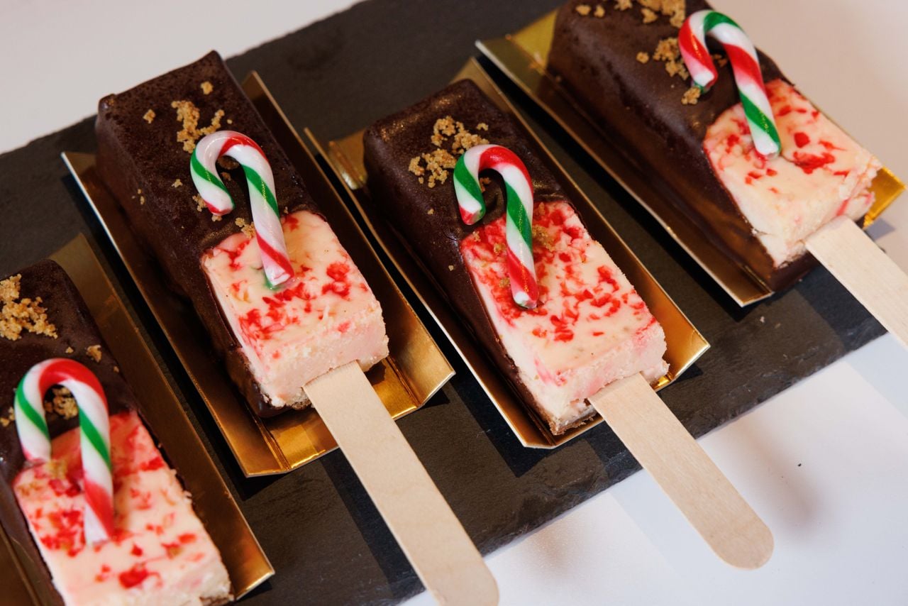 A candy cane cheesecake lollipop