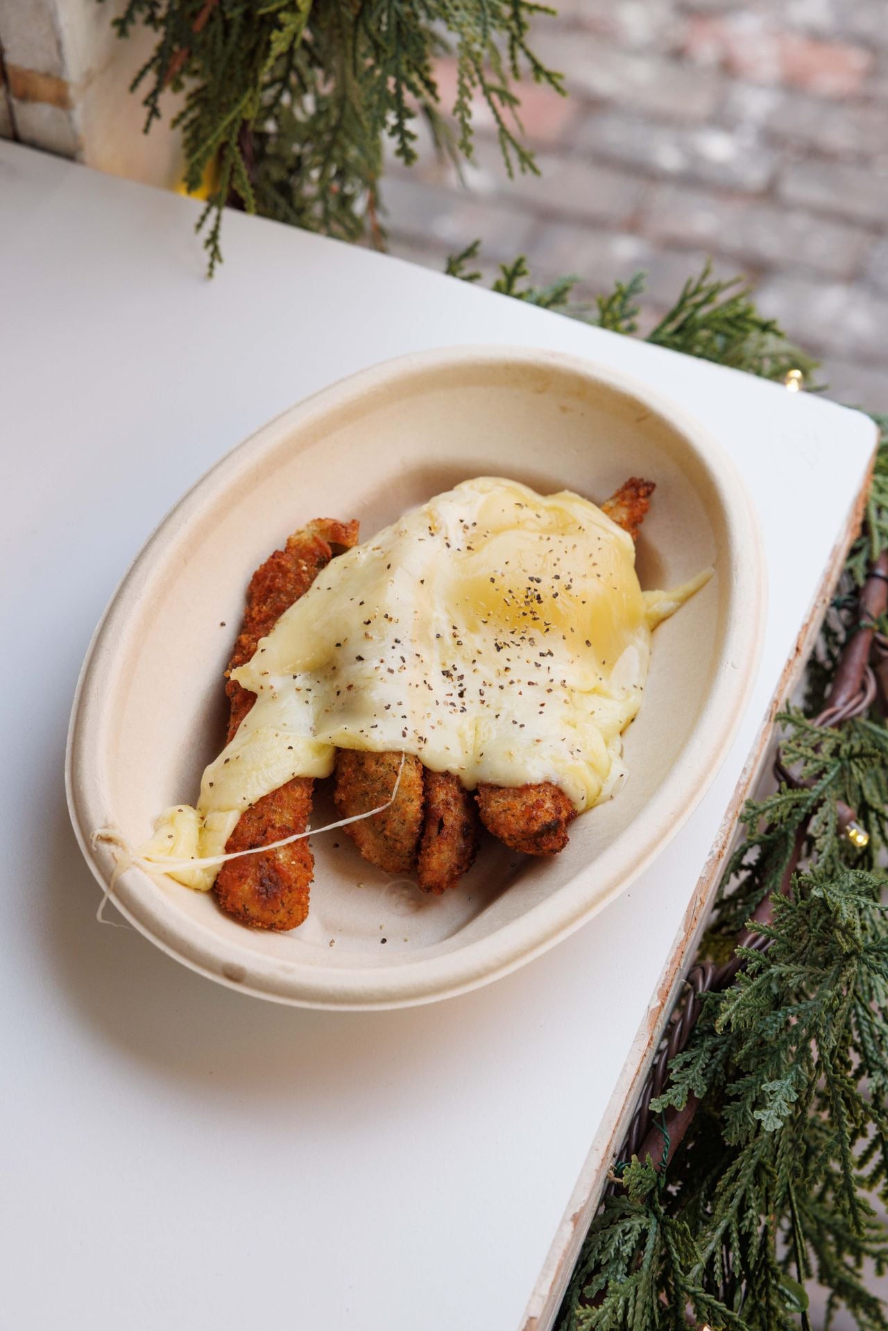 Fried pickles topped with raclette