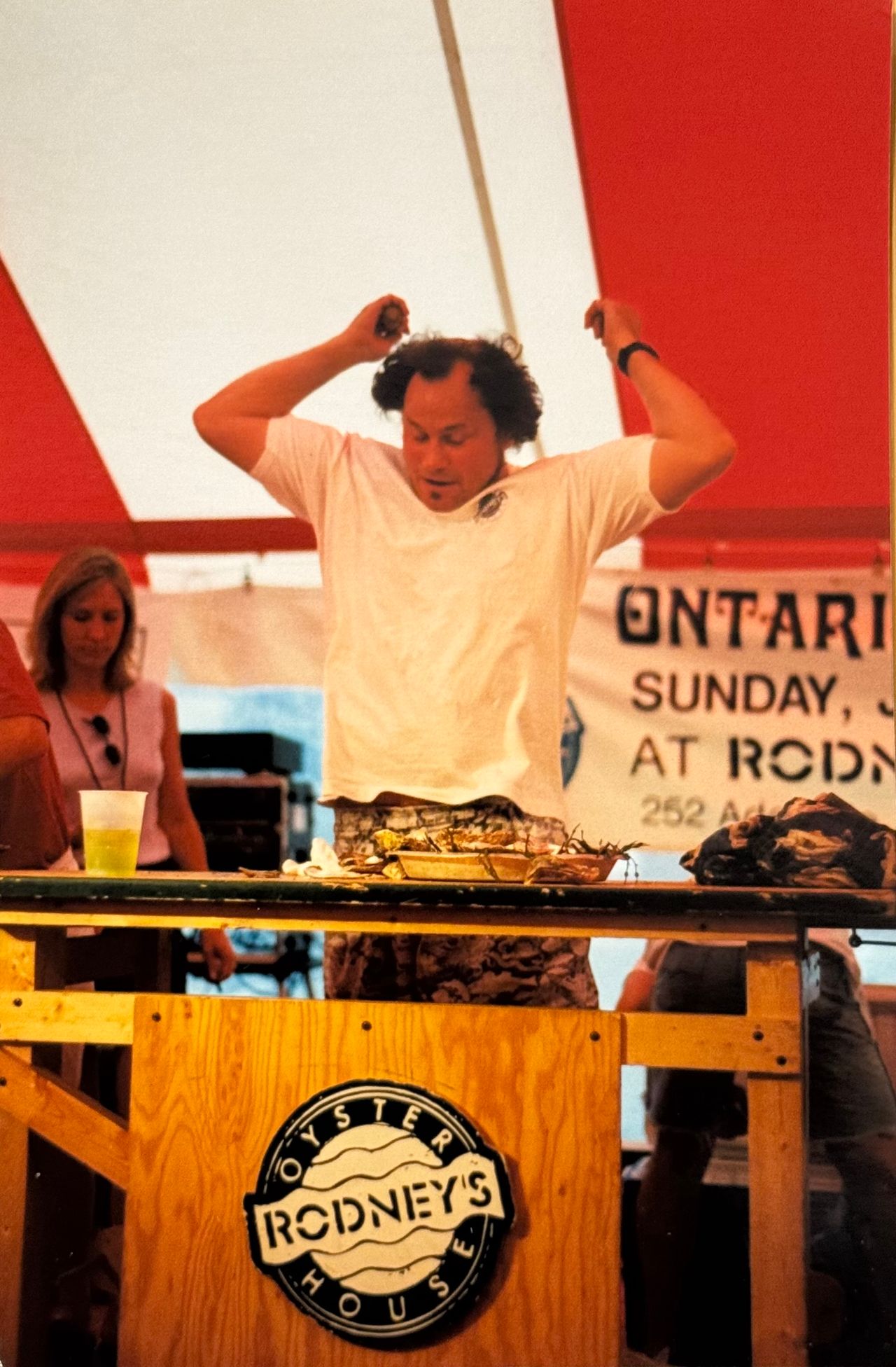 Rodney Clark celebrates at an oyster shucking competition
