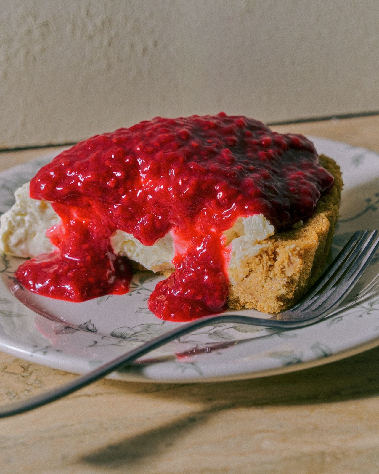 New York–style cheesecake with raspberry compote