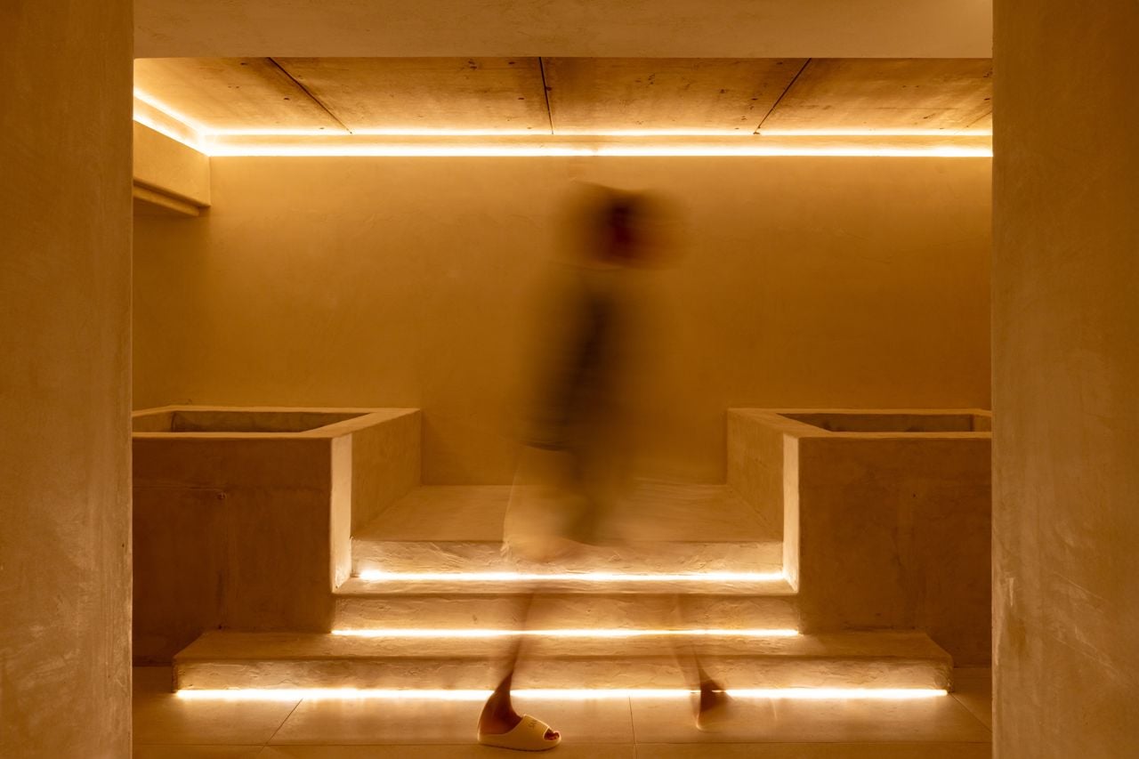 A person walks through a sauna