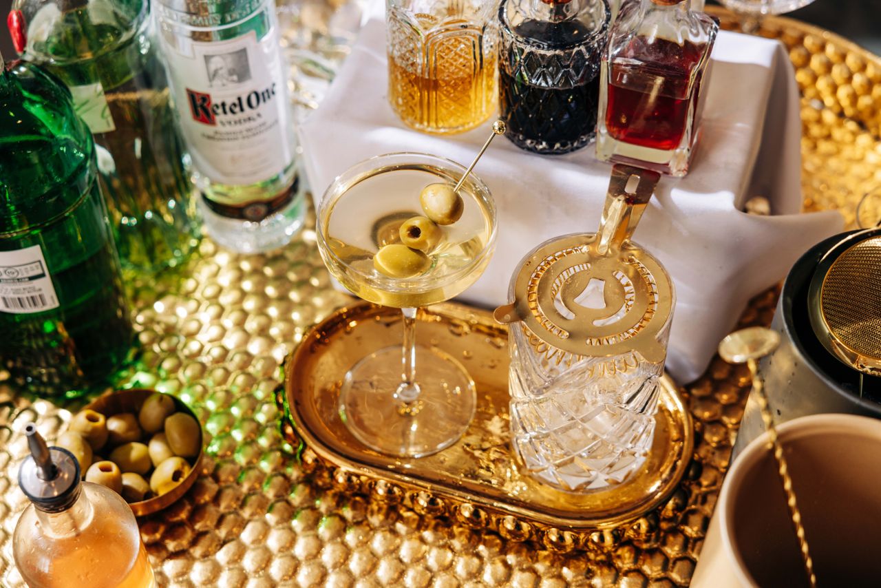 A martini on a bar cart