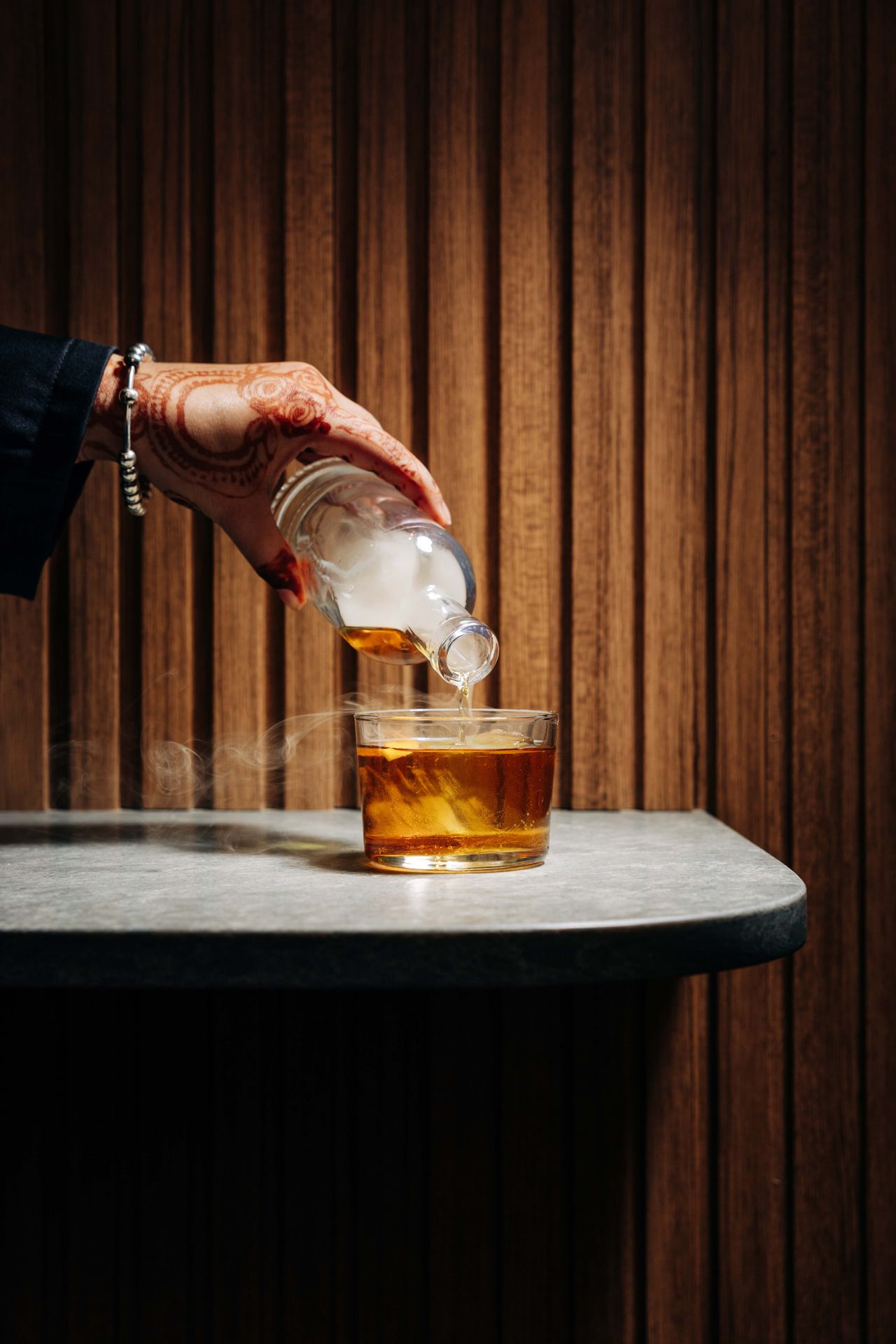 Golden saffron lends its luxurious aroma and hue, while a smoky, boozy blend of dark rum, whiskey, and herbal Benedictine gives the Saffron Smoke real depth