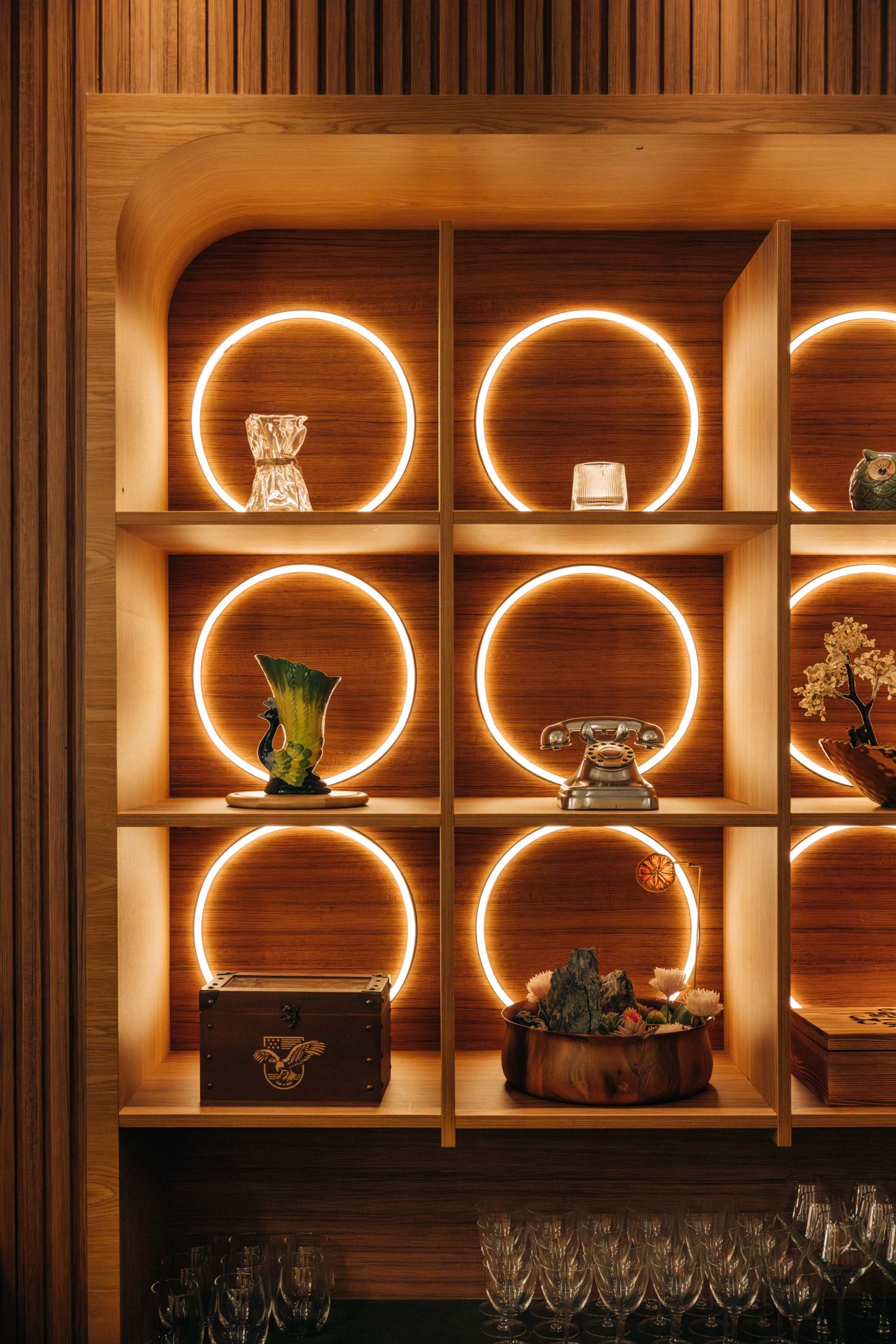 Shelves lined with decorative items at ORO, a modern Indian restaurant in Toronto