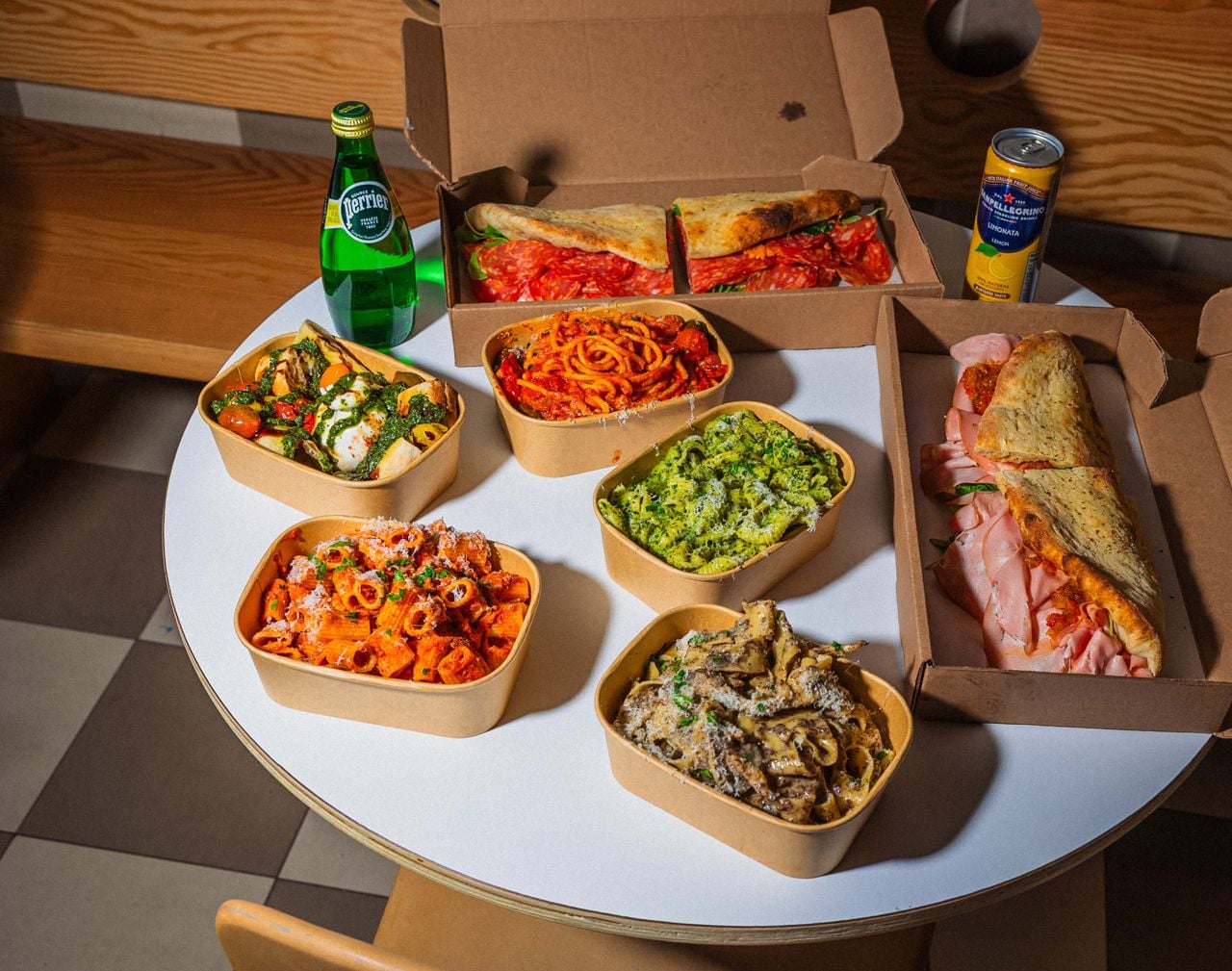 A spread of pasta and Italian sandwiches