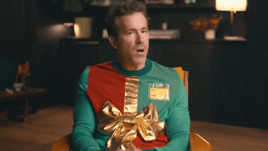 Ryan Reynolds backs the Blue Jays in his ugly Christmas sweater