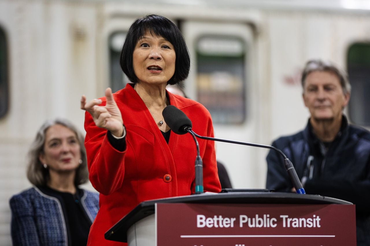 Oliva Chow makes an announcement in front of a TTC train